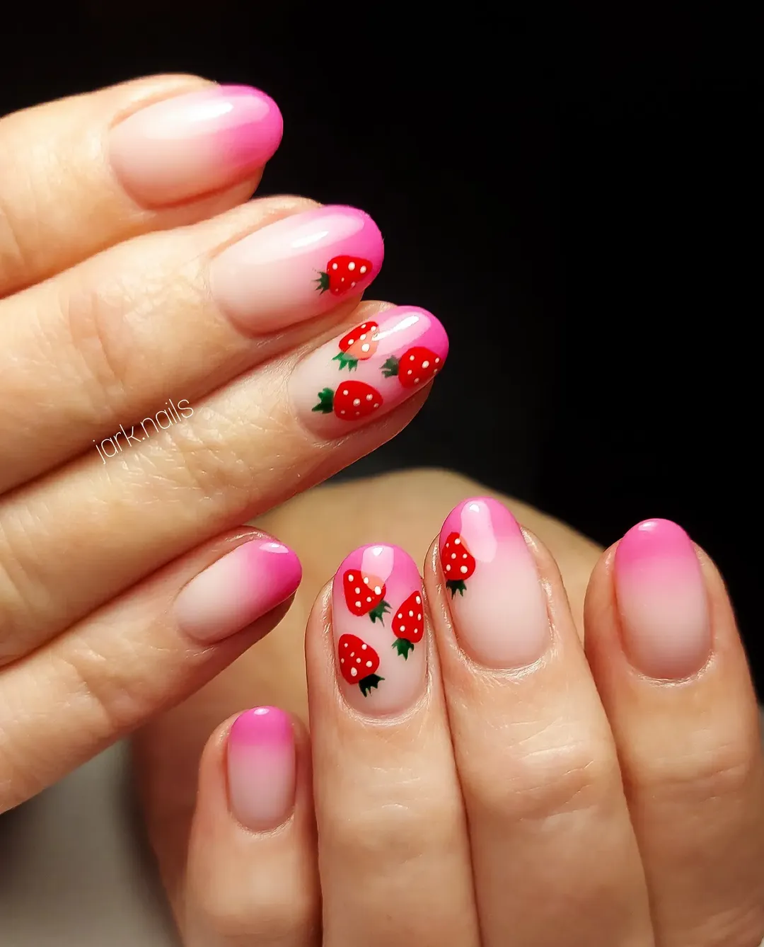Soft blend pink ombre nails with strawberry nail art