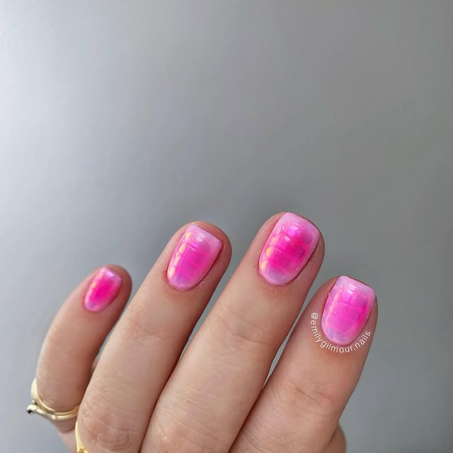Pink ombre nail with chrome snake print overlay