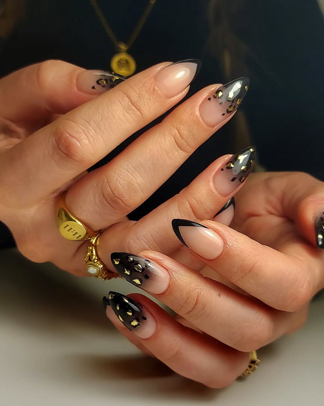 Black ombre nails with leopard print design
