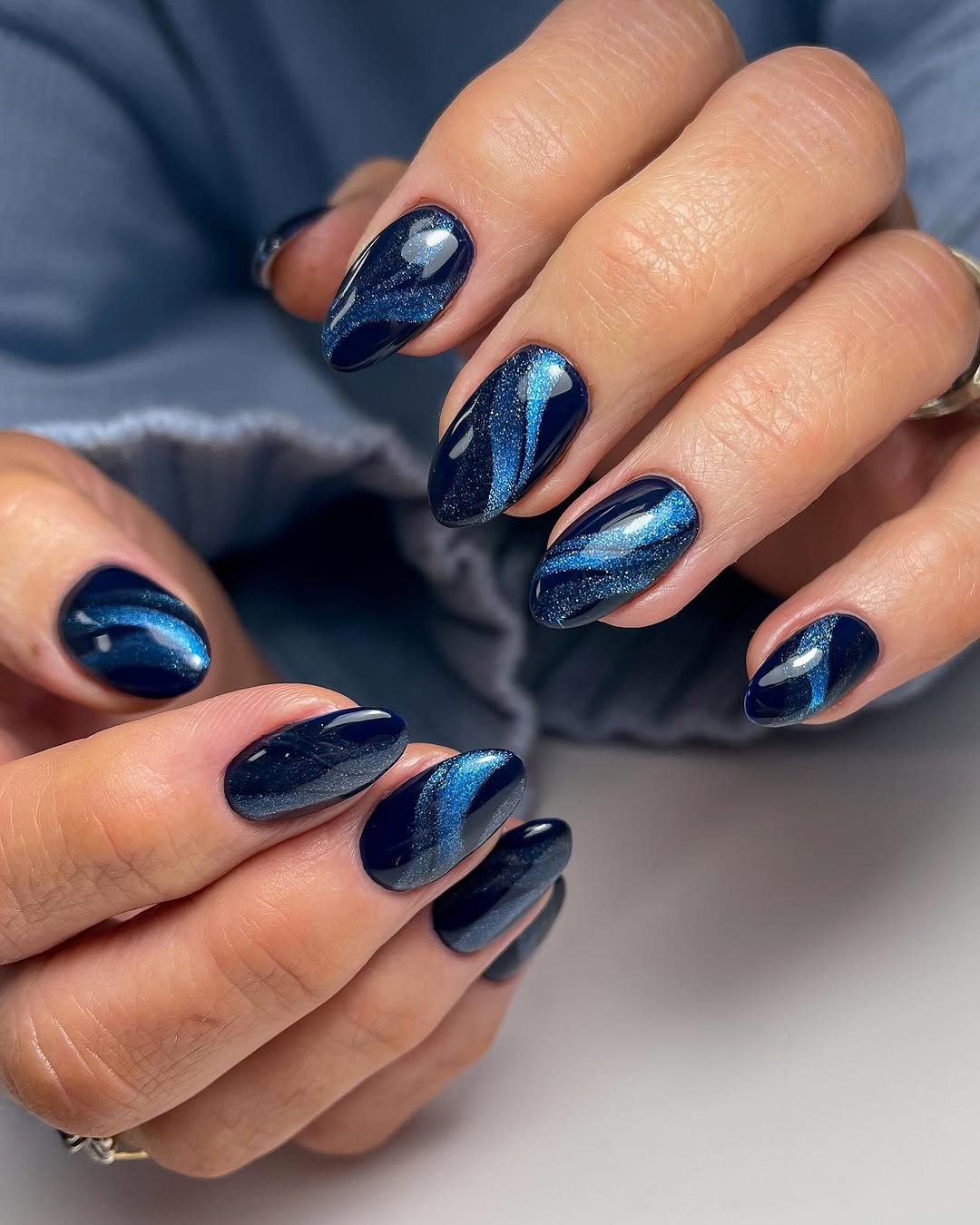 Blue ombre nails with swirls
