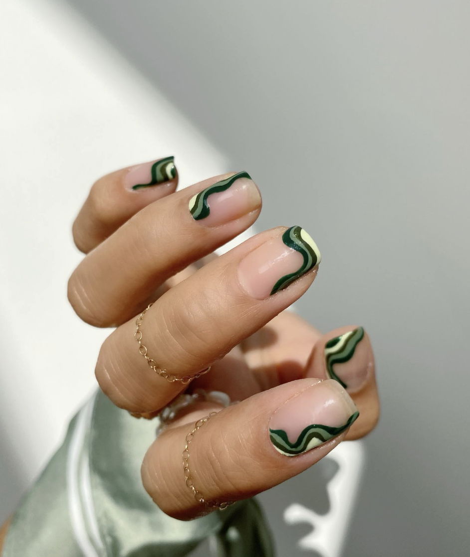Dark green swirl French tip nails