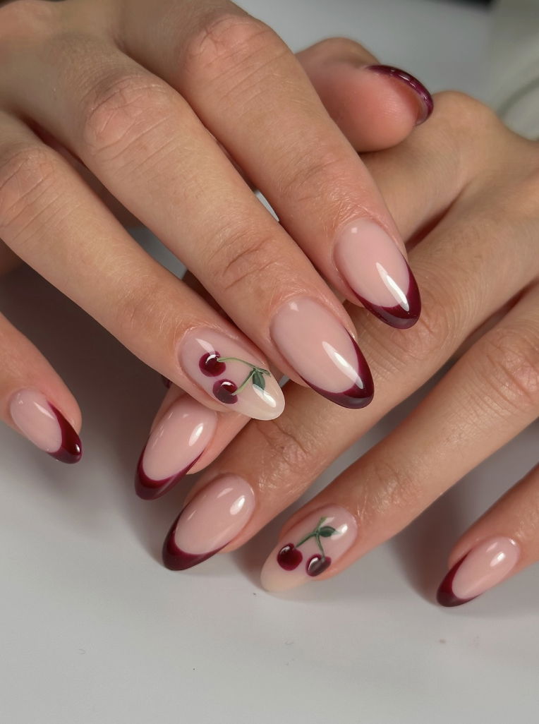 Dark red French tip nails with cherries