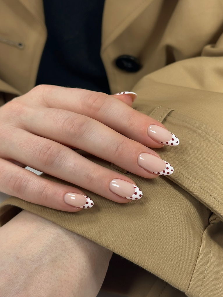 Red and white polka dot French tip nails