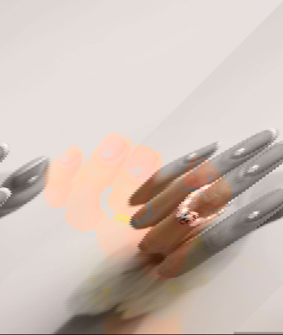 White French tip nails with pearls