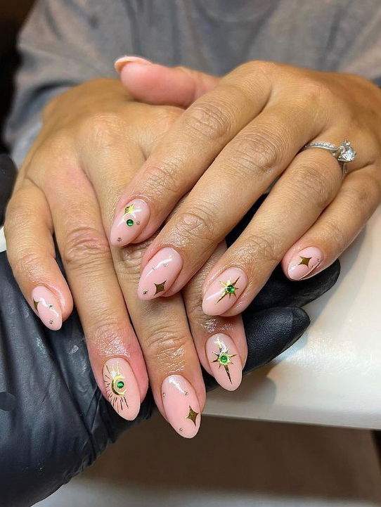 nude nails with gold stars and gems