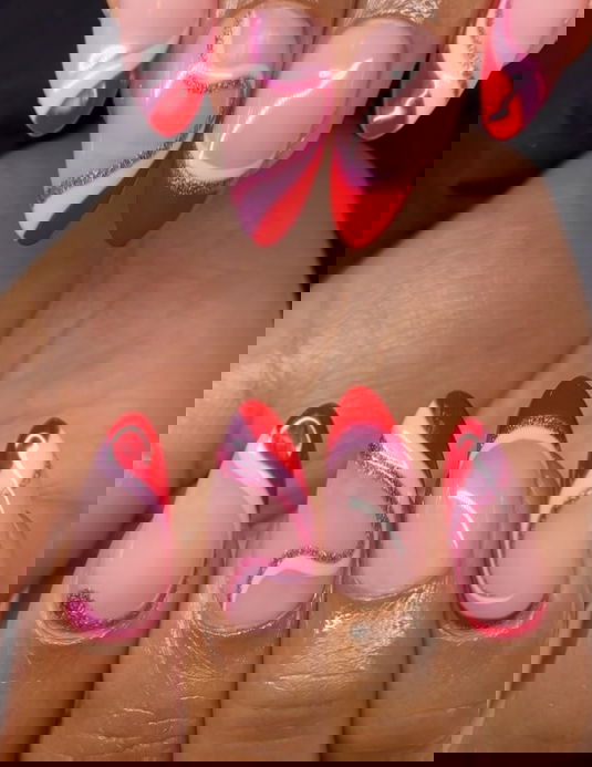 pink and red swirl nails with pink glitter