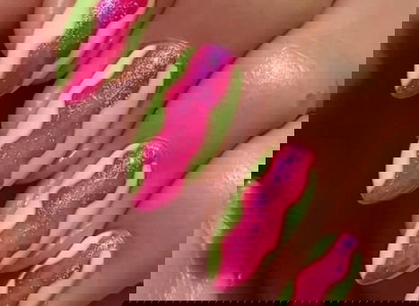 pink and yellow squiggle colour block nails