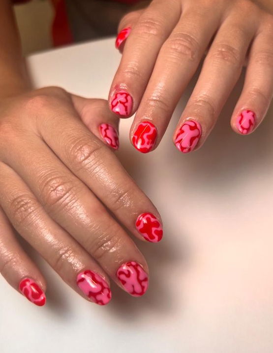 red and pink swirl nails