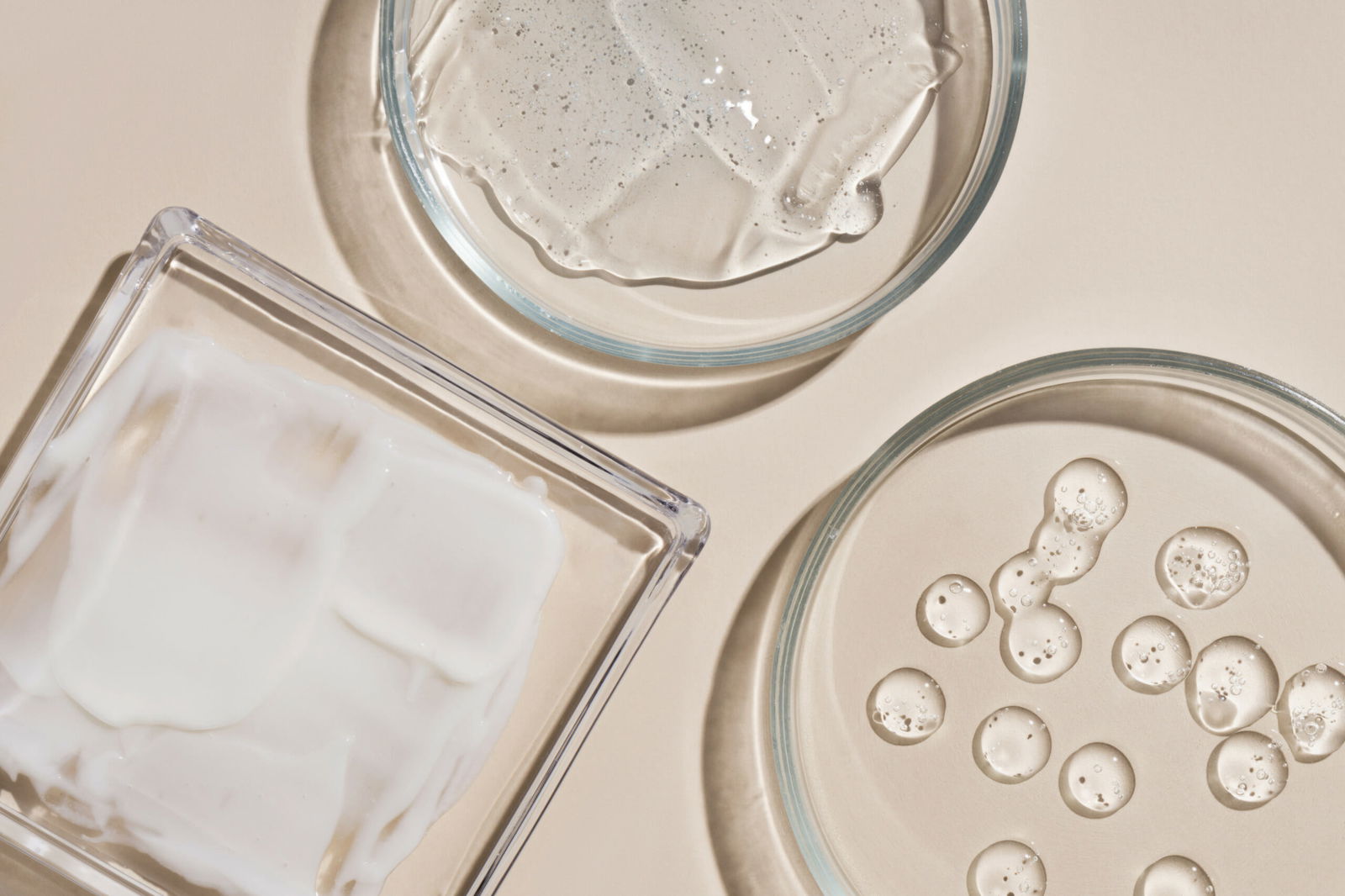 Drops and smears of various cosmetics Assortment of cosmetics h | Live That Glow can shampoo cause acne? conditioner serums