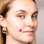 Girl wearing a pimple patch