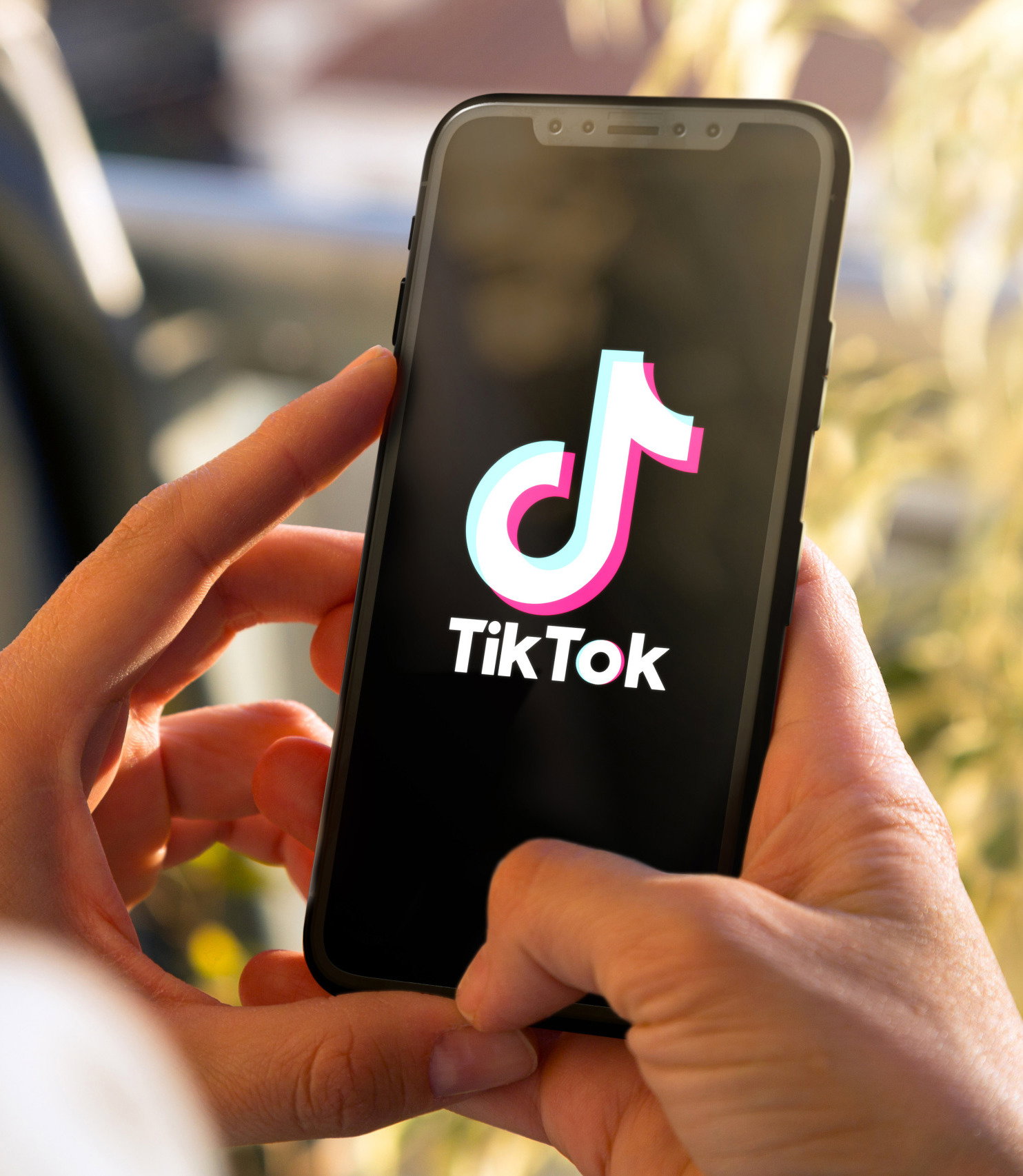 Tiktok on mobile phone Screen Young woman holding a Smart Phone | Live That Glow Experts Weigh in on *These* Popular TikTokTrends. Tiktok on mobile phone Screen. Young woman holding a Smart Phone with Tik Tok app. ROSARIO, ARGENTINA -MARCH 15, 2023.