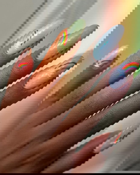 green pink and blue chrome nails with rainbows