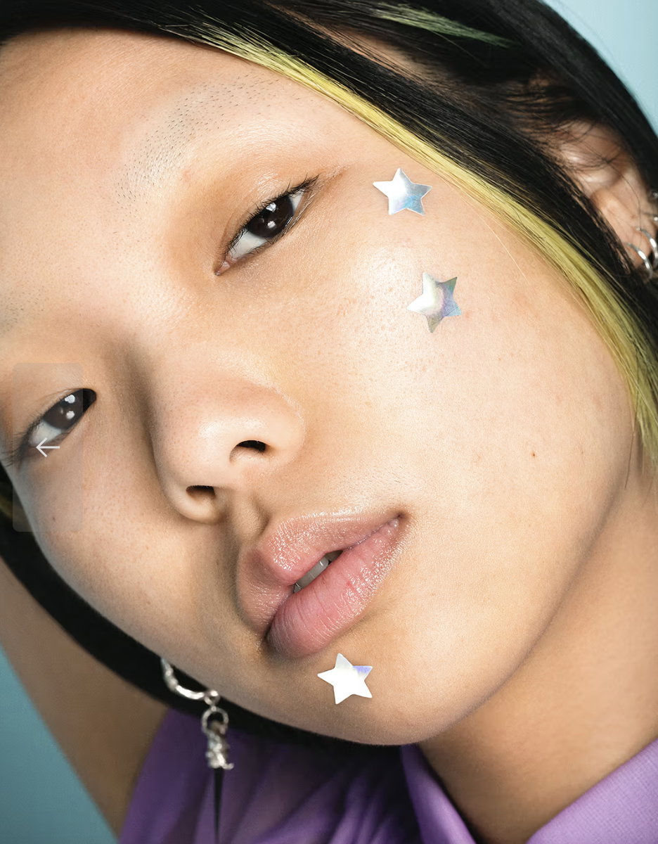 Woman using pimple patch on acne