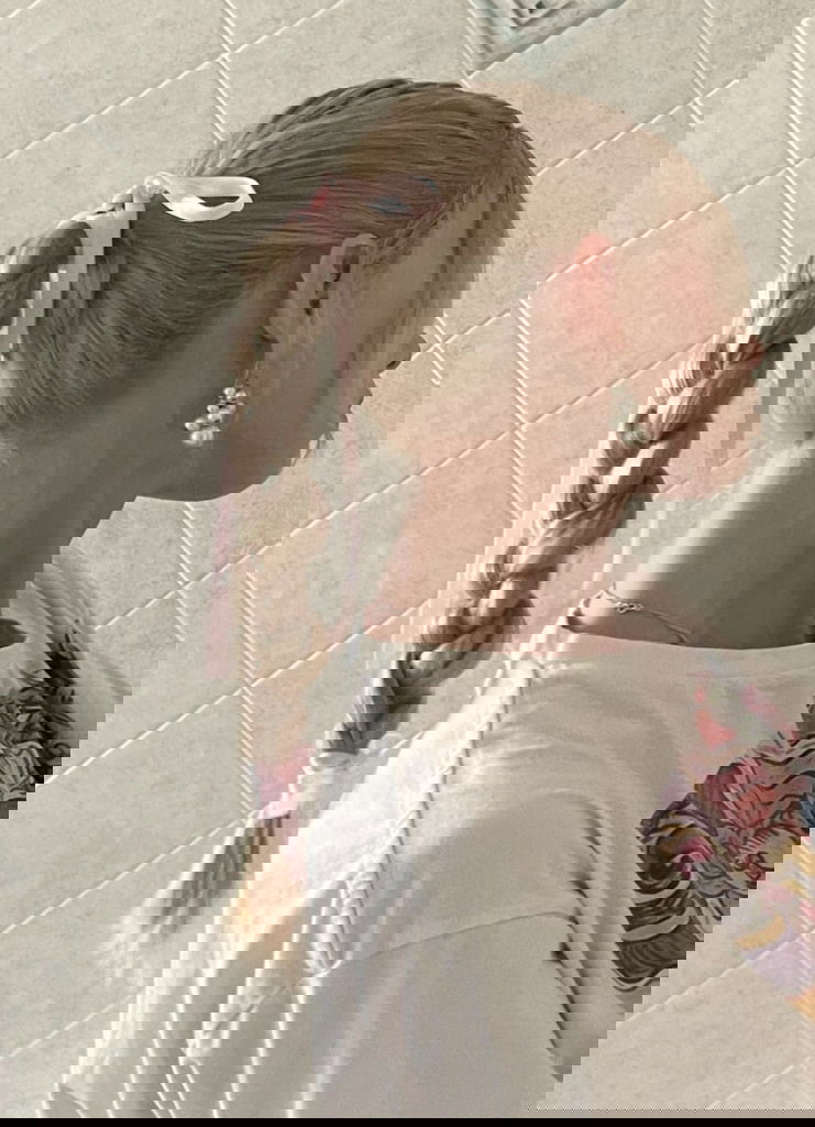 Woman with ribbon in her hair showing the popularity of hair accessories