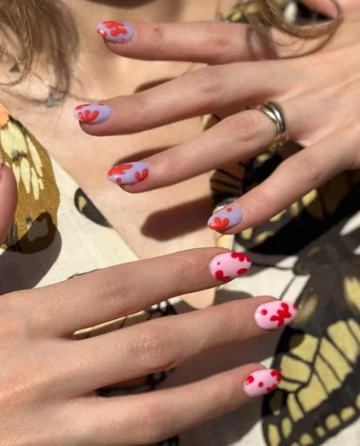 Long red abstract nails with pink and purple