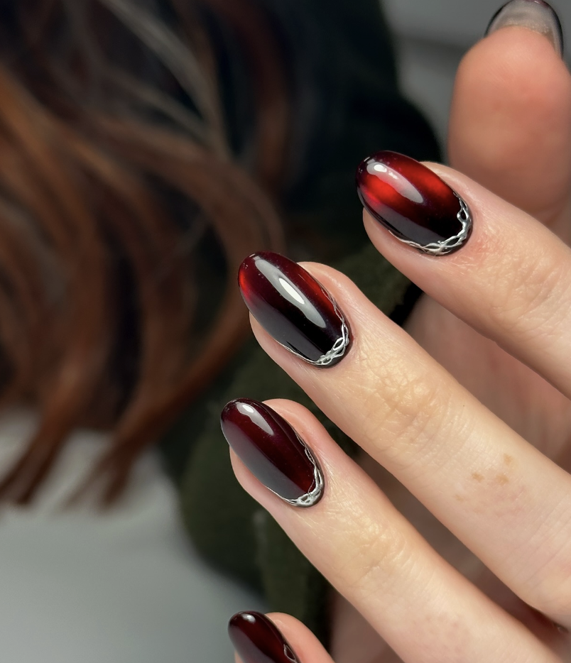 Rich deep red nails with aura effect