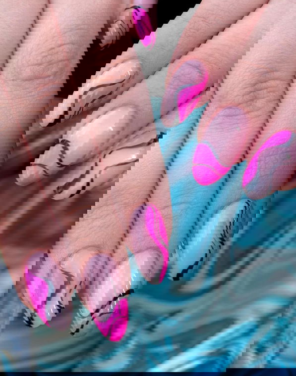 black and pink wavy french tip nails