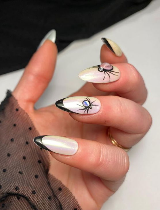 black french tip nails with bug rhinestones