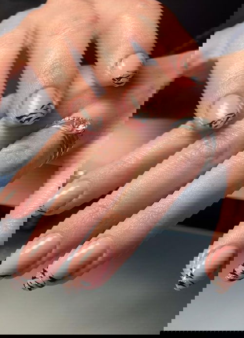 black zebra french tip nails with silver glitter