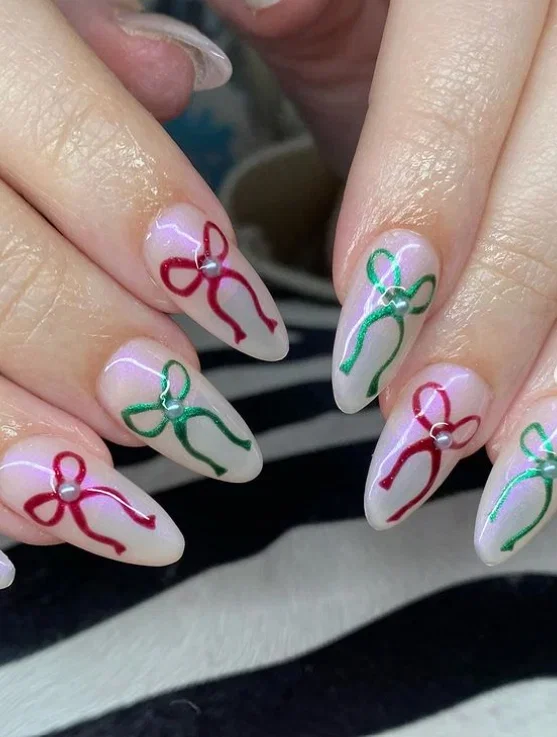 Coquette green and red almond nails with bows