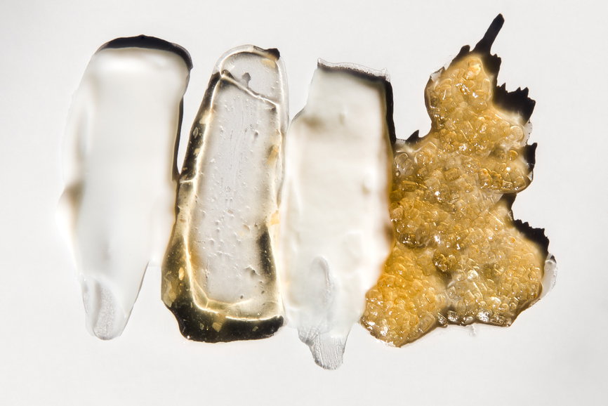 Overhead shot of a series of skincare product such as creams, serums and scrubs