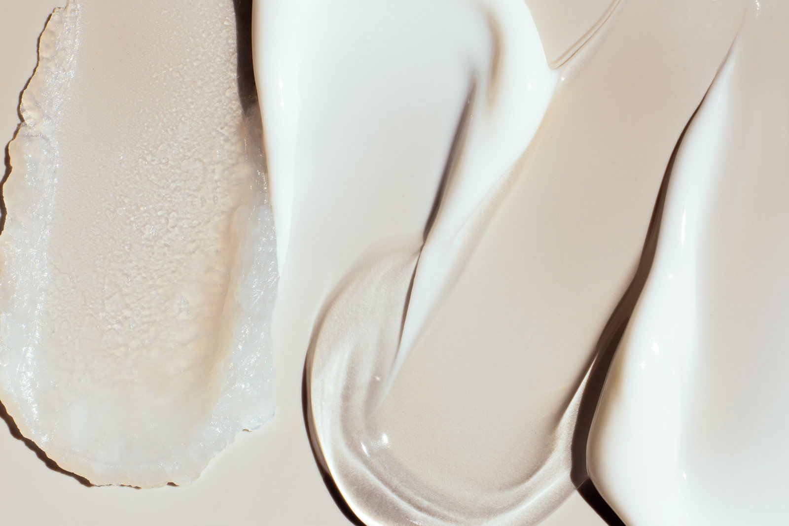 smears samples of various cosmetic textures on a beige background | Live That Glow