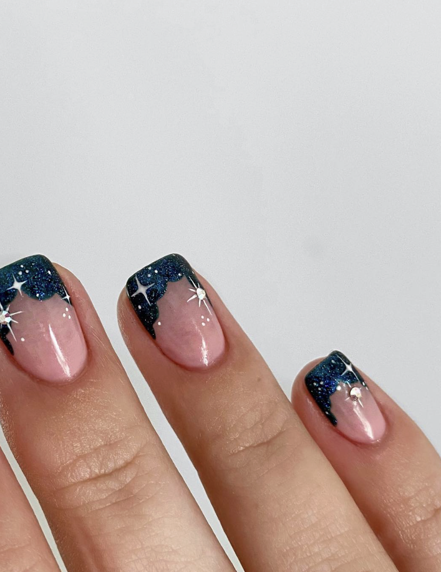Blue acrylic French tips with silver stars | Live That Glow Blue acrylic French tips with silver stars