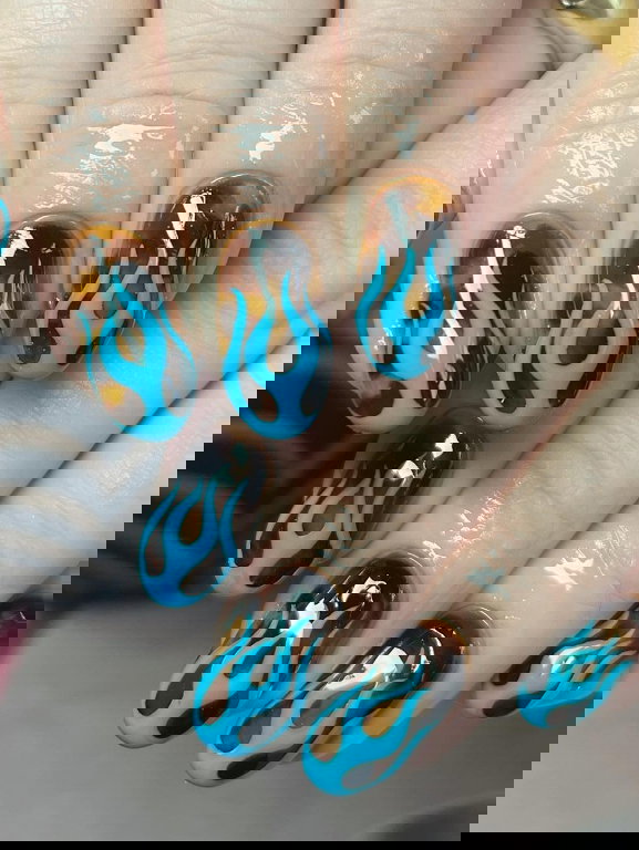 Tortoiseshell nails with bright blue flame French tips