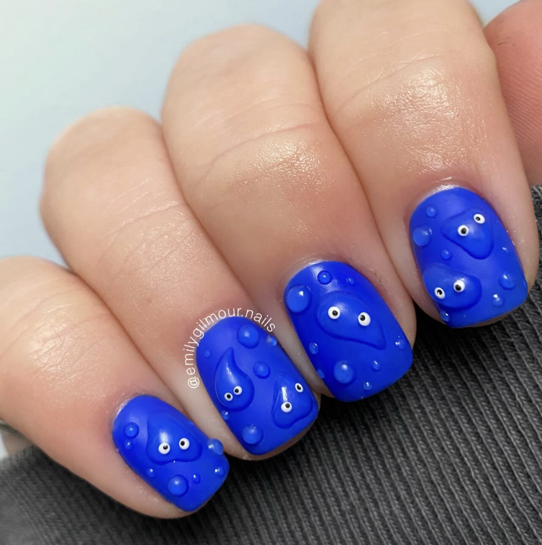 blue-neon-bubble-nails | Live That Glow Bright blue neon nails with raised bubble nail art and tiny eyes
