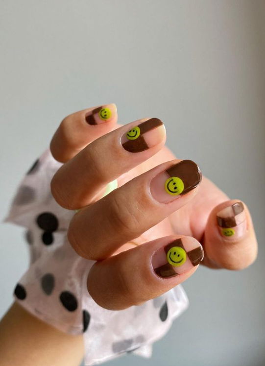 brown checkered nails with smiley faces