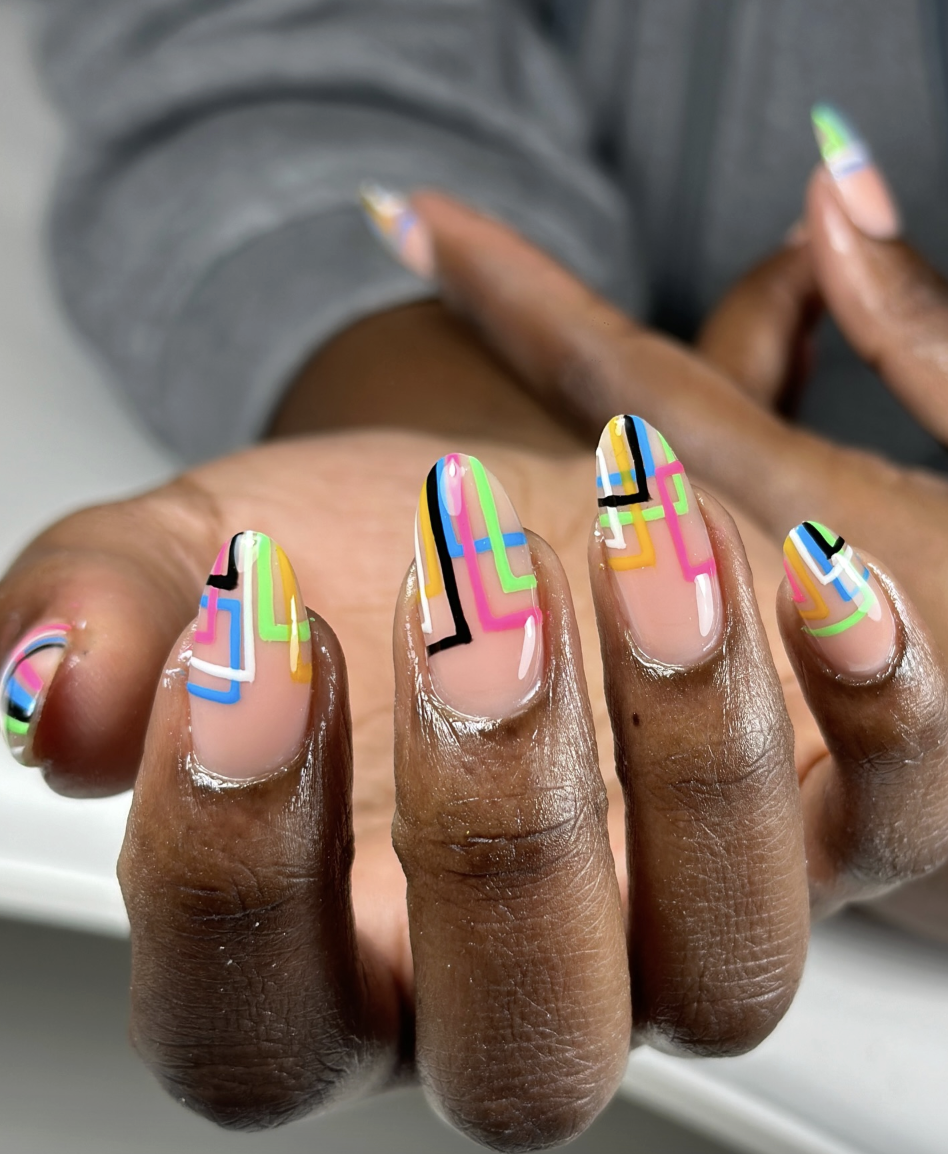 graphic-neon-line-nails | Live That Glow Nude almond nails with graphic neon pink, green, blue and yellow line art