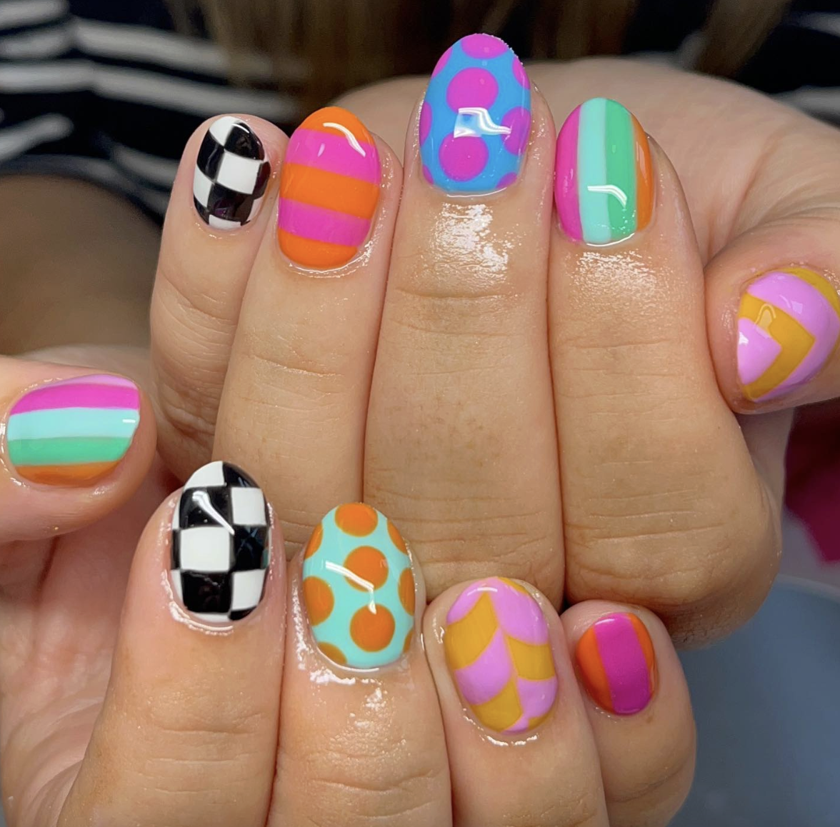 maximalist-neon-nail-art | Live That Glow Colourful neon nails with checkerboard, stripes, dots and graphic nail art