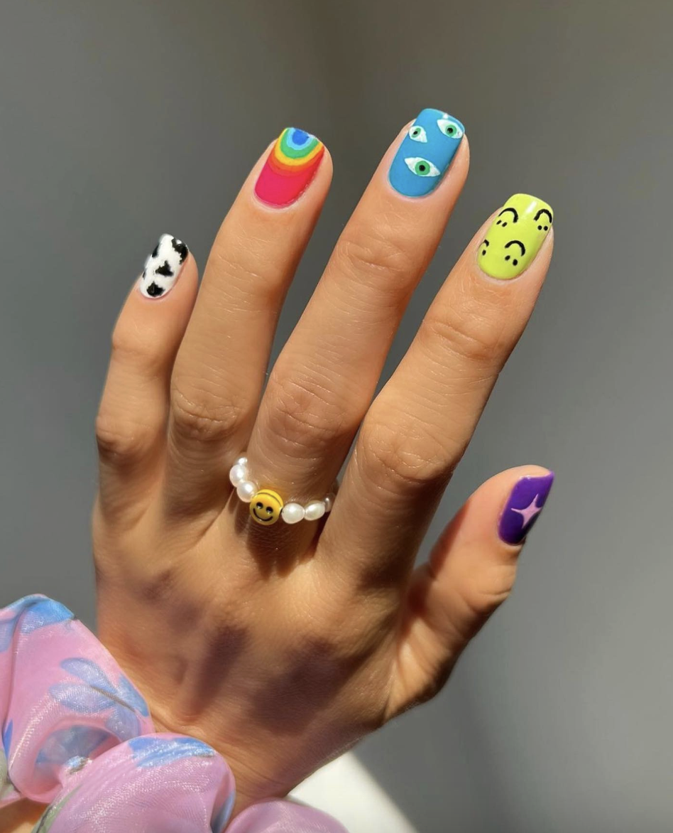 mismatched-neon-nail-art | Live That Glow Mismatched neon nails with rainbow, eye, smiley face and cow-print designs