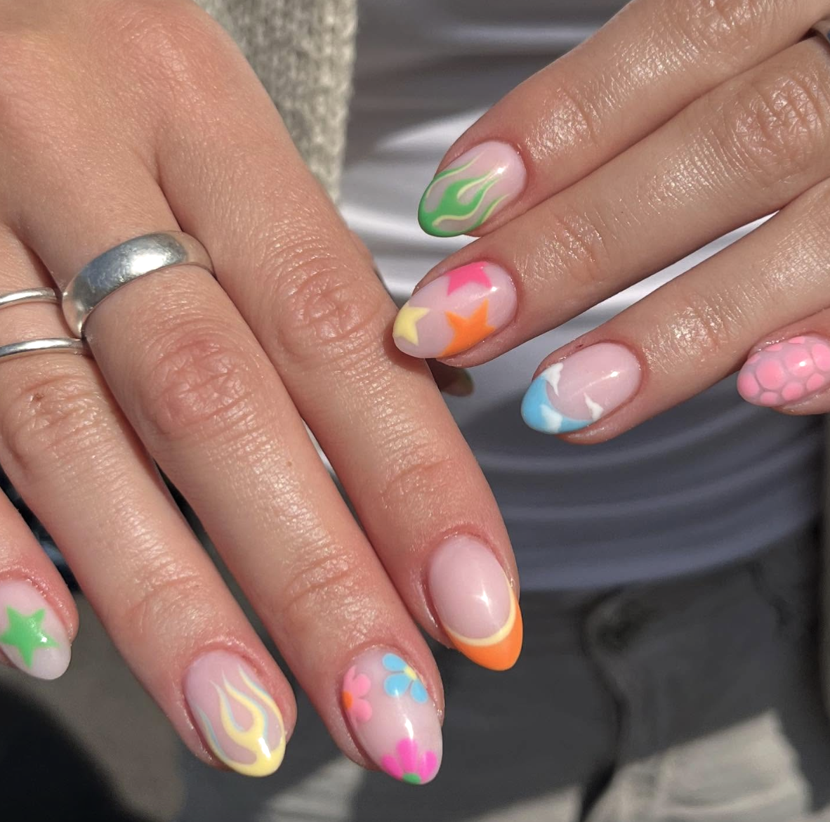 mixed-neon-summer-nail-art | Live That Glow Nude nails with colourful neon flames, stars, flowers and French tips