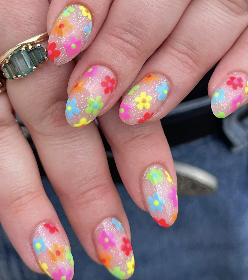 neon-flower-nails | Live That Glow Glittery nude nails covered in colourful neon flower nail art