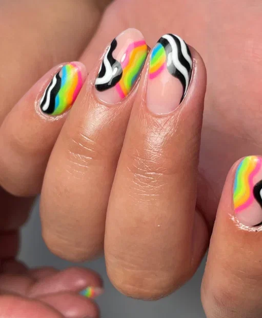 neon-rainbow-wave-nails | Live That Glow Nude nails with wavy neon rainbow and black-and-white graphic nail art