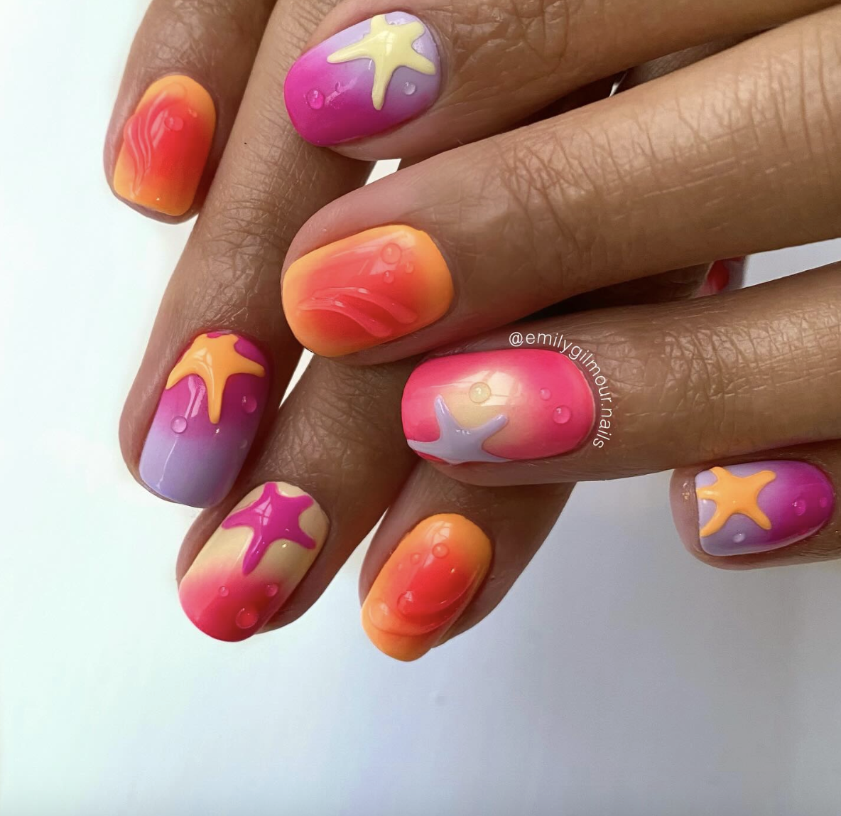 neon-starfish-nails | Live That Glow Colourful pink, orange and purple aura nails with raised starfish and bubble details