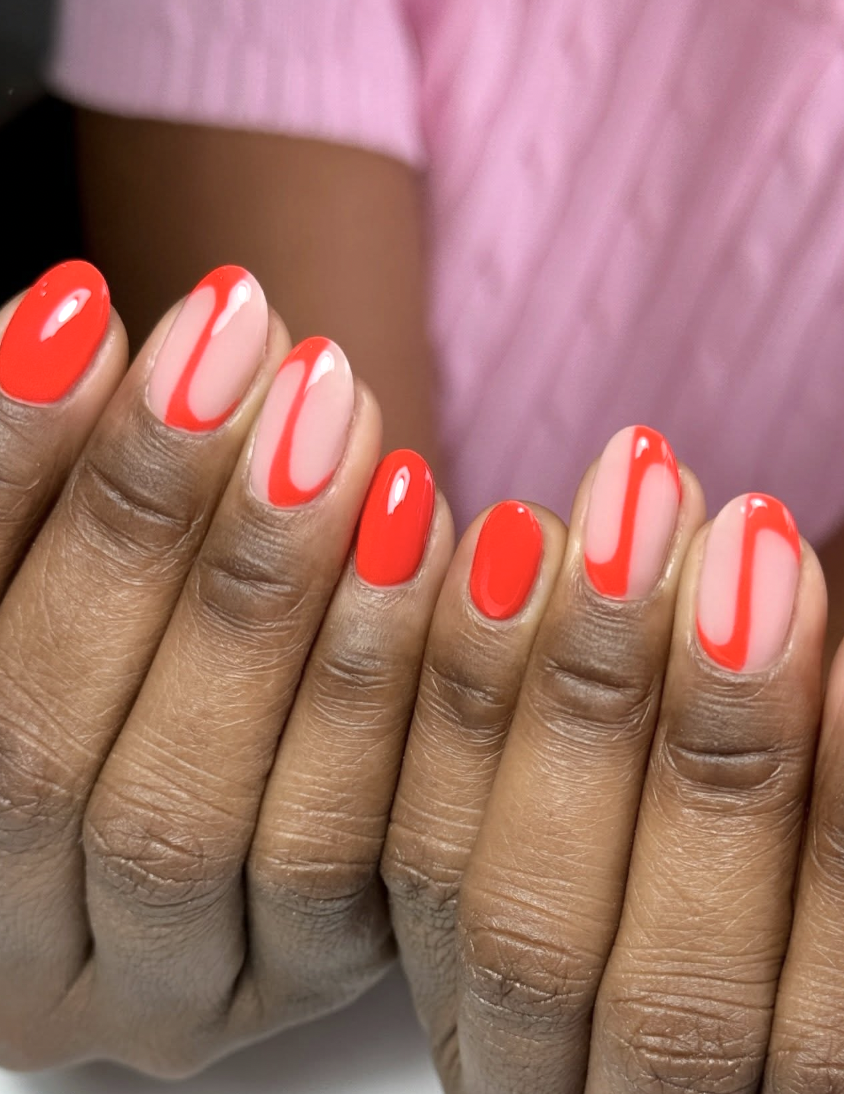 orange-neon-swirl-nails | Live That Glow Glossy nude and bright orange neon nails with curved swirl details