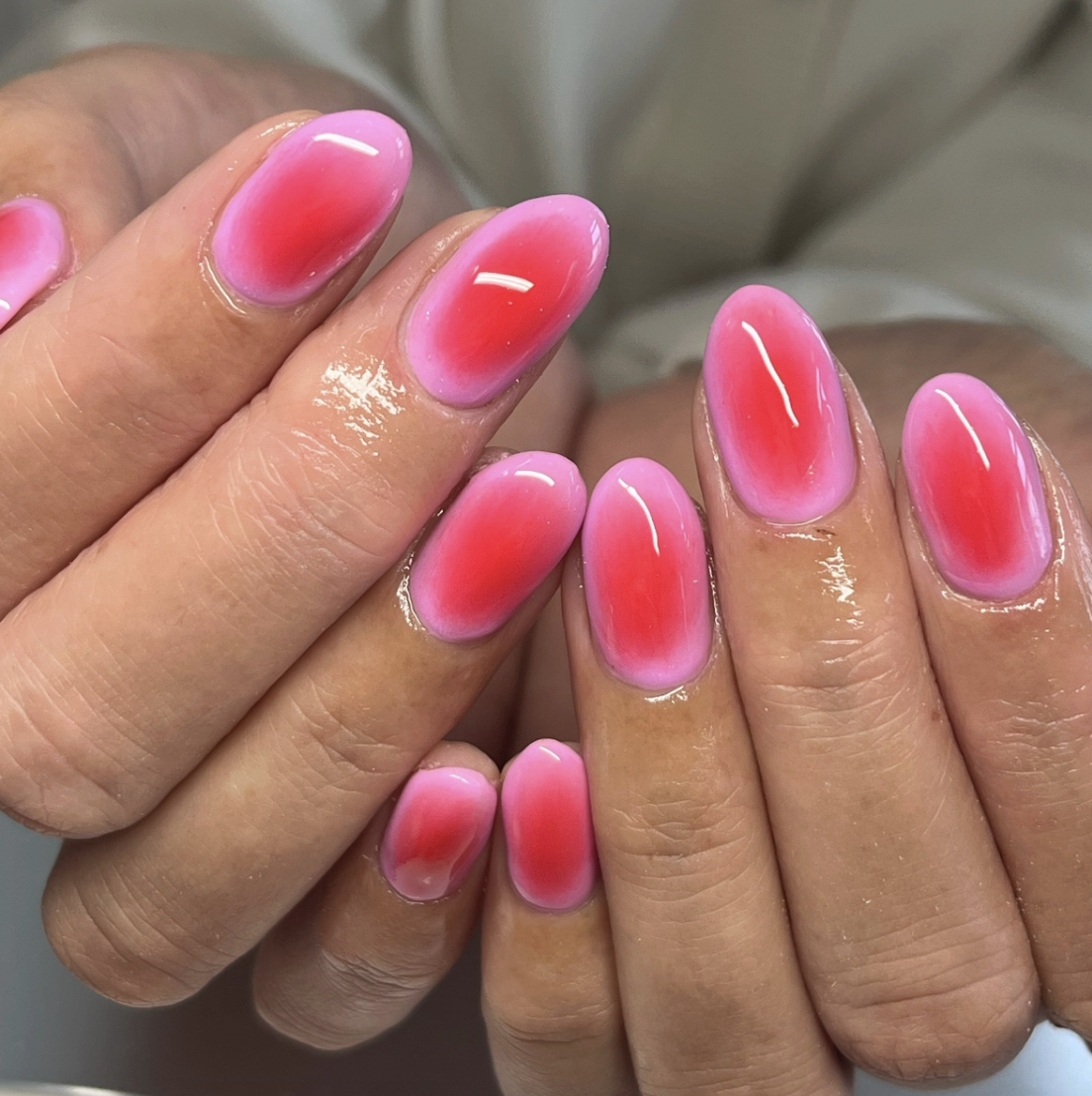 pink-neon-aura-nails | Live That Glow Glossy pink neon aura nails with vivid red-pink centres