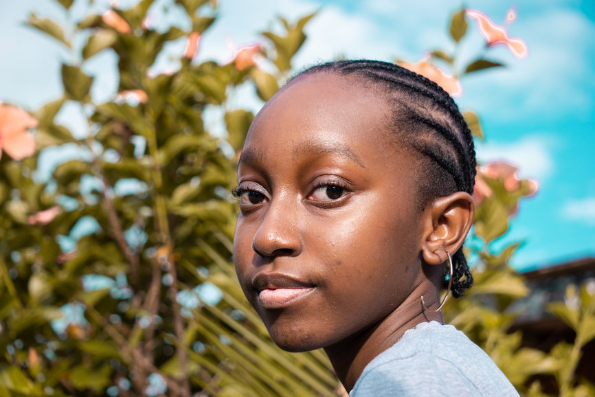 Black African teenage girl with braided hair | Live That Glow