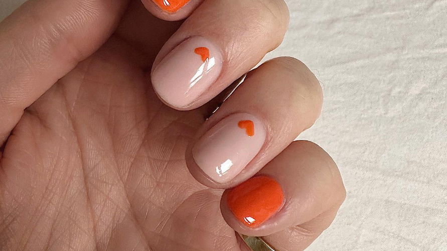 https://www.livethatglow.com/wp-content/uploads/2024/02/orange-valentines-nails-.jpg