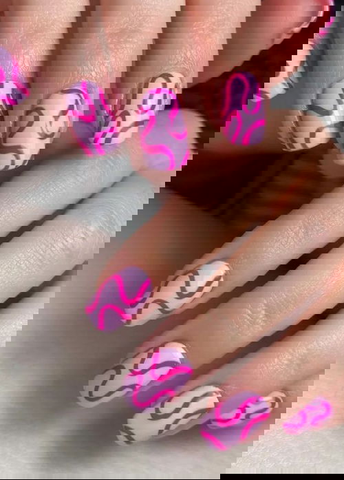 Purple nails with hot pink swirls