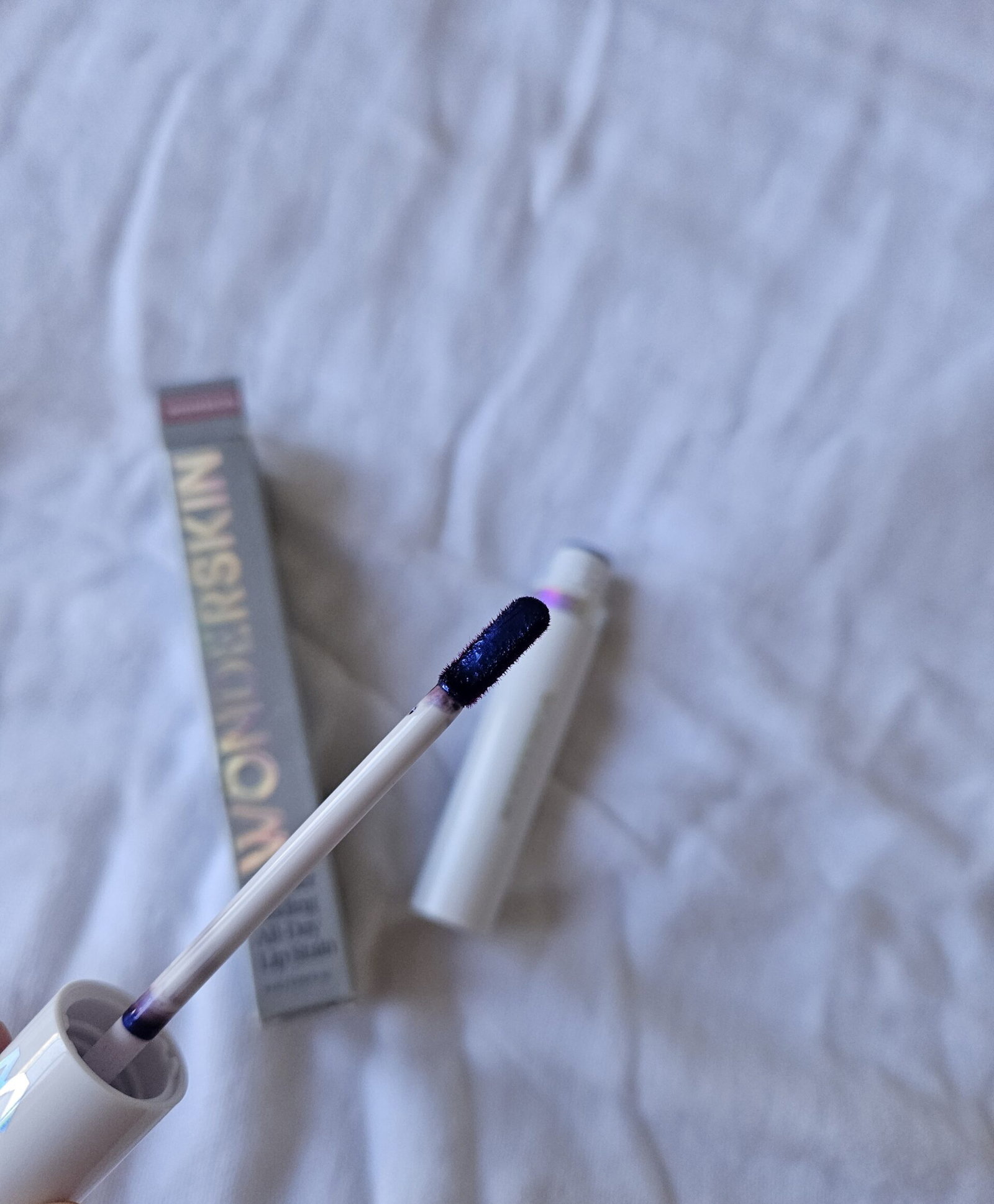 Wonderskin Lip Stain applicator coated with Whimsical lip stain