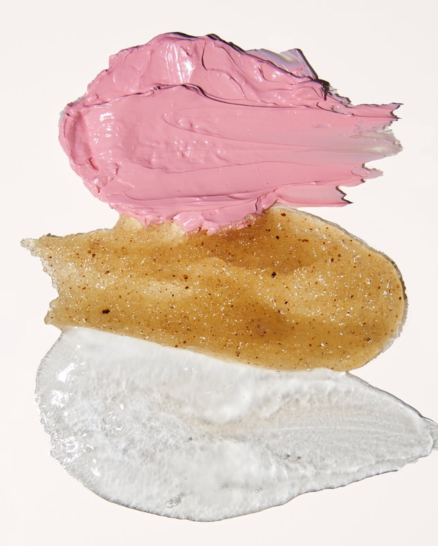 Skincare cleanser scrub and mask textures on a beige surface | Live That Glow