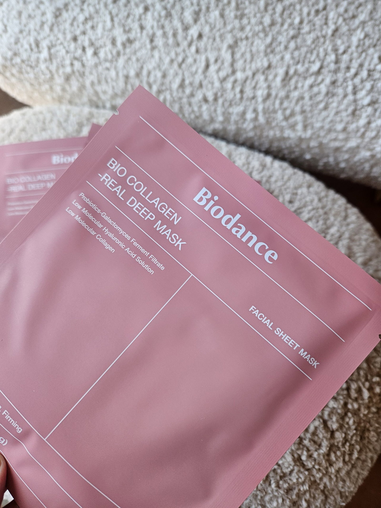 biodance-bio-collagen-real-deep-mask-packaging | Live That Glow Pale pink sachet for Bio Balance Real Deep Mask facial sheet mask on a beige carpet surface.