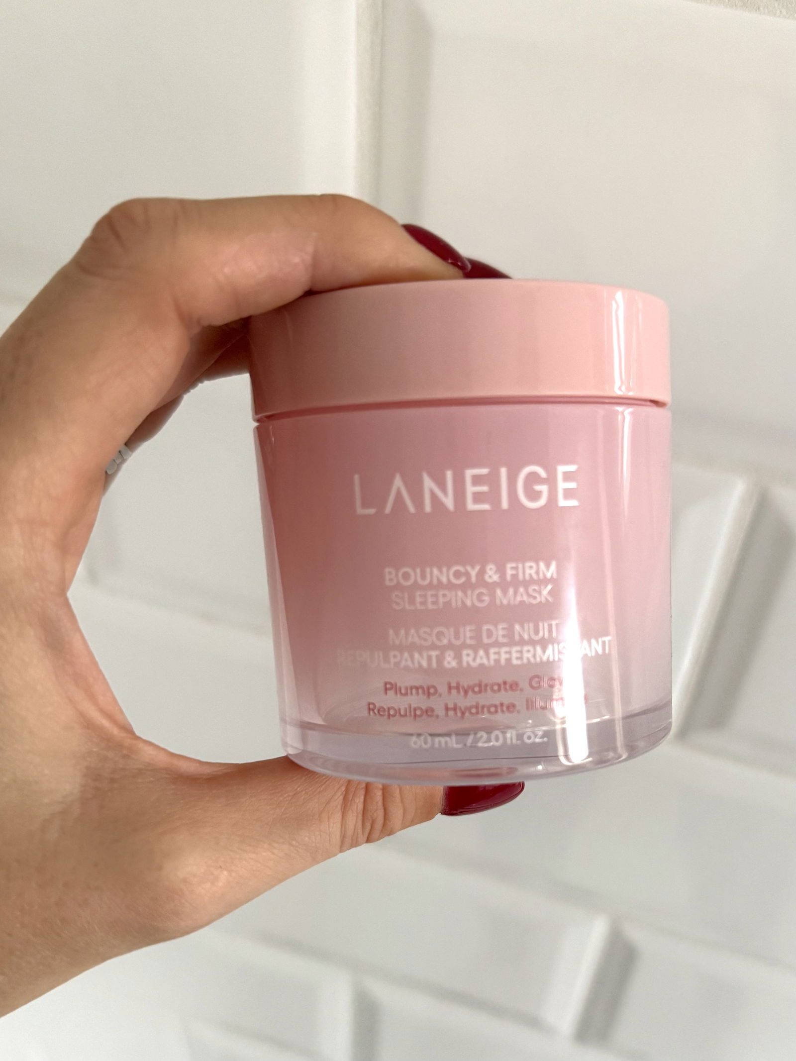 Laneige Bouncy & Firm Sleeping Mask held in hand