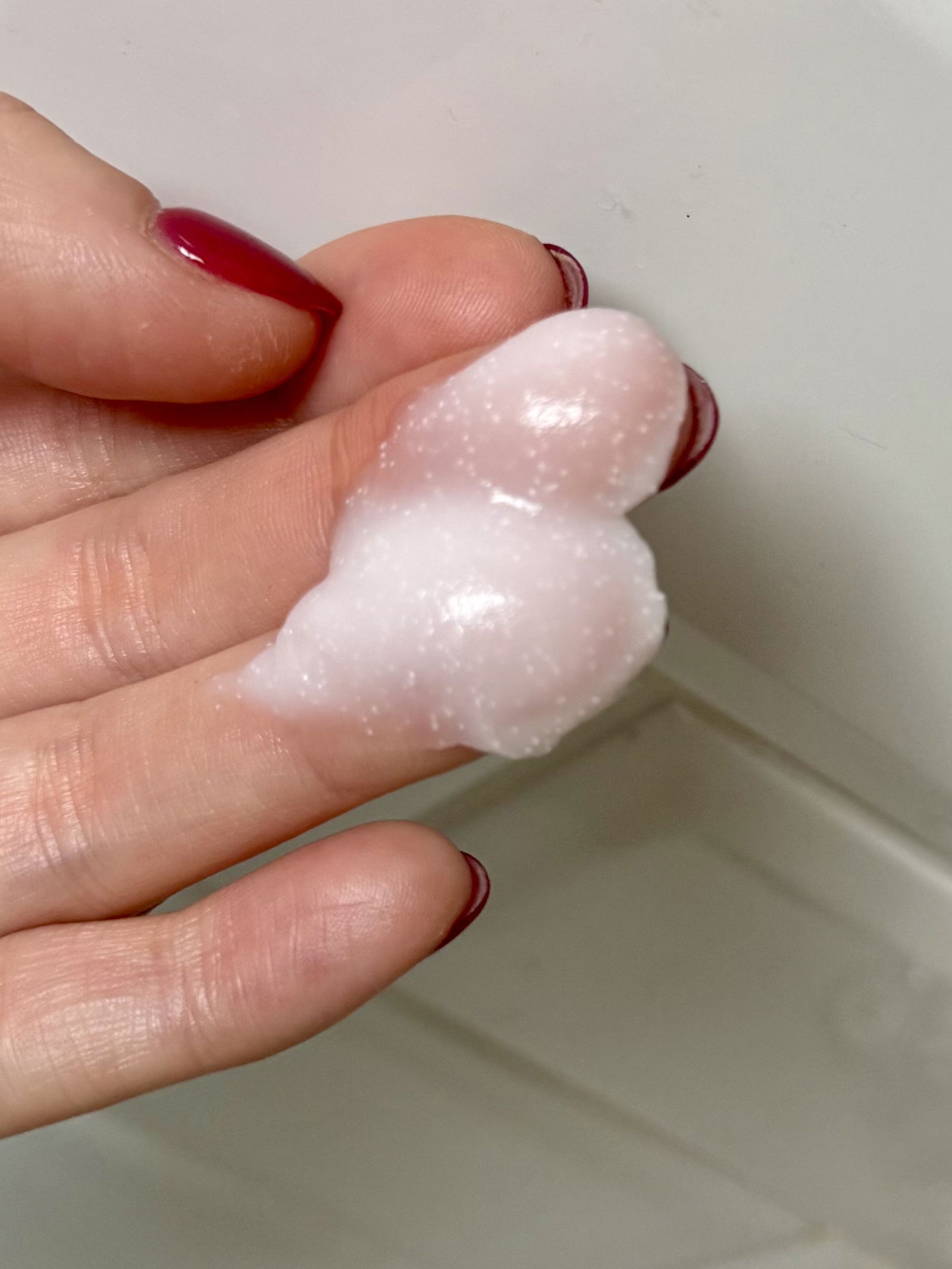 Laneige Bouncy & Firm Sleeping Mask scoop of product with texture on fingers