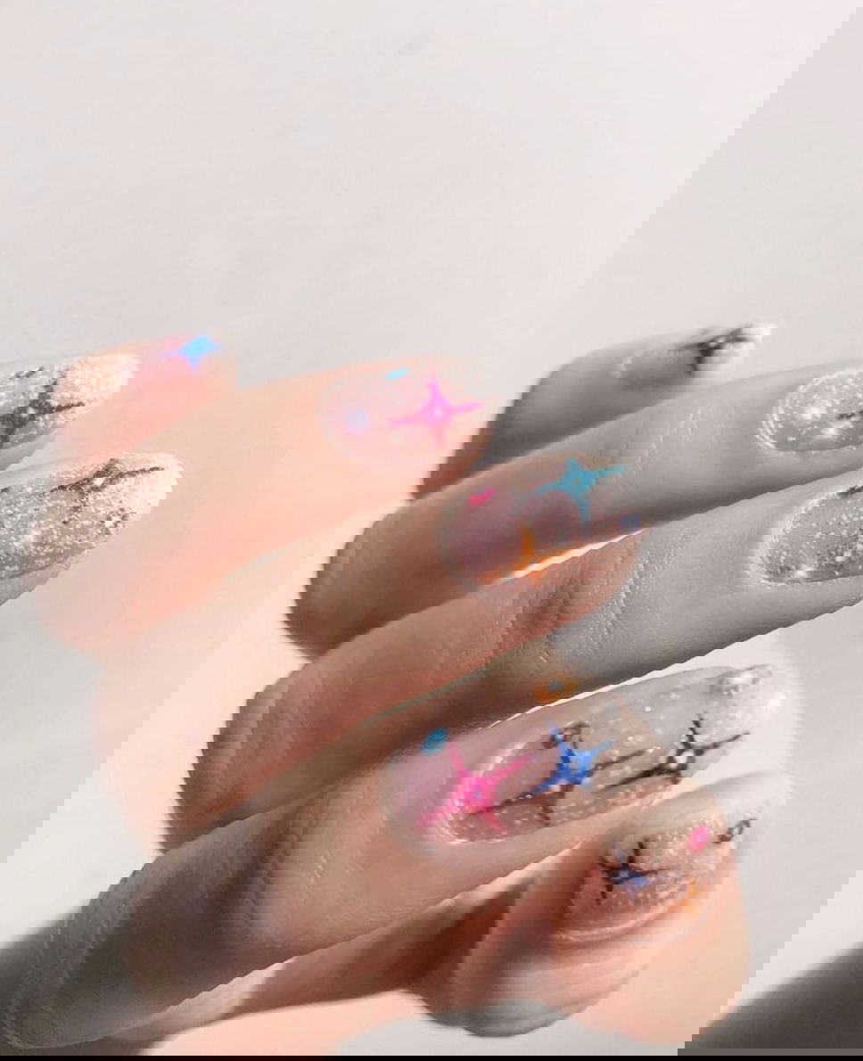 Pink sparkly star Christmas nails