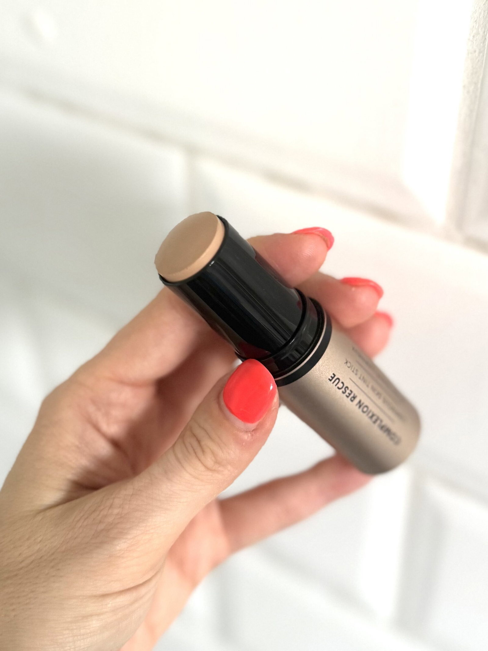 BareMinerals Complexion Rescue Luminous Skin Tint Stick in hand