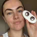 Holding the ZIIP Halo microcurrent facial device during testing.
